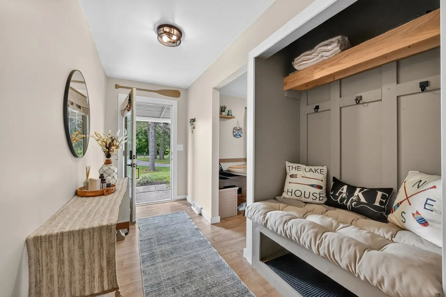 Entry with paddle-themed decor and lake house cushions
